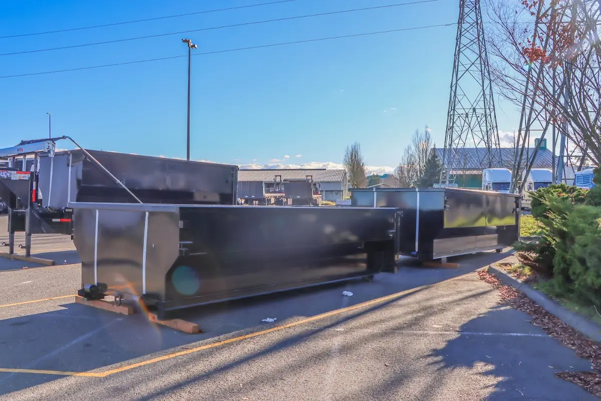 Roll-off dumpster ready for waste disposal at job site for 2 Yard Dumpster Rental in Saginaw